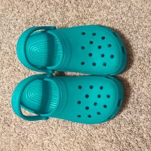 Teal Crocs